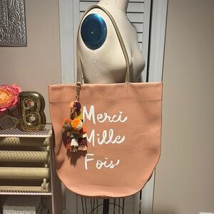 EUC Anthropologie Merci Mille Fois Peach Tote Bag with tassel charm.